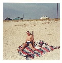 Bob Comer getting sunburn on Pensacola beach, summer 1967.